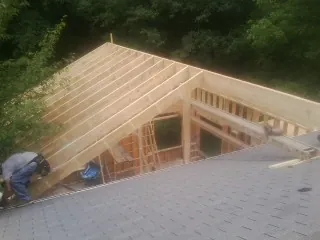 Framing a new roof addition that ties into an existing shingle roof in Alexandria